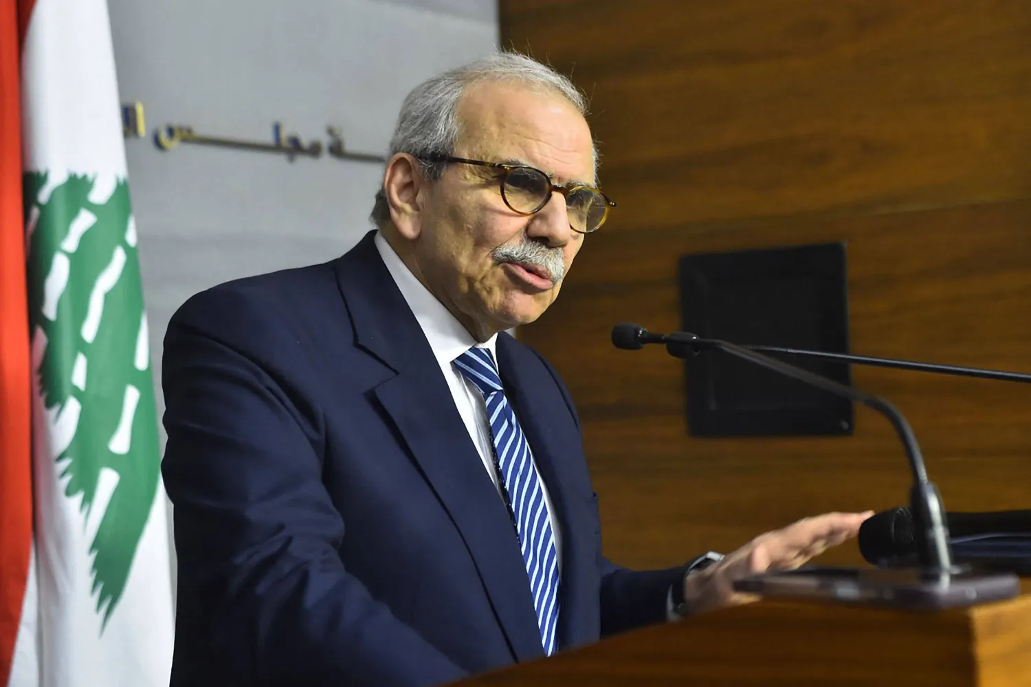 A photograph released by the Lebanese Government Press Office on December 26, 2025, show Prime Minister Nawaf Salam speaking during a press conference after a cabinet session in Beirut on December 26, 2025. (Photo by Handout / Lebanese Government Press Office / AFP)
