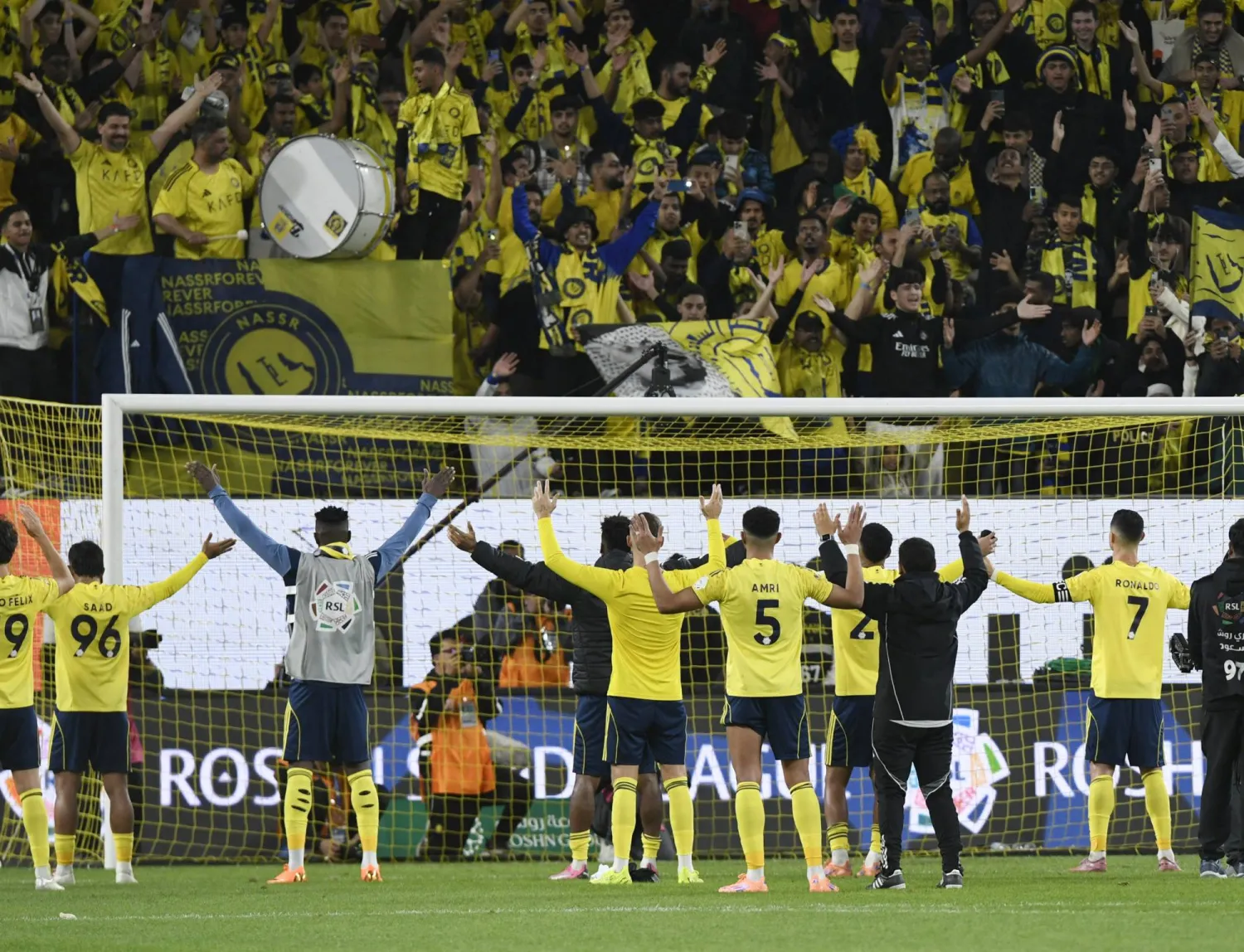 Football - Saudi Pro League - Al Nassr v Al Okhdood - Al Awwal Park, Riyadh, Saudi Arabia - December 27, 2025 Al Nassr's Cristiano Ronaldo with teammates celebrate after the match. (Reuters)