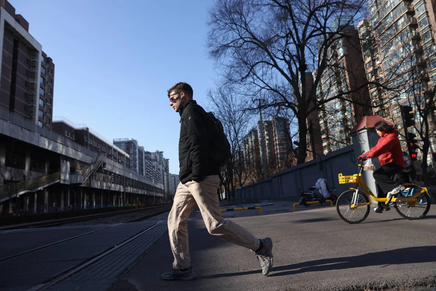 A man walks on a street in Beijing, China, 24 December 2025. EPA/WU HAO