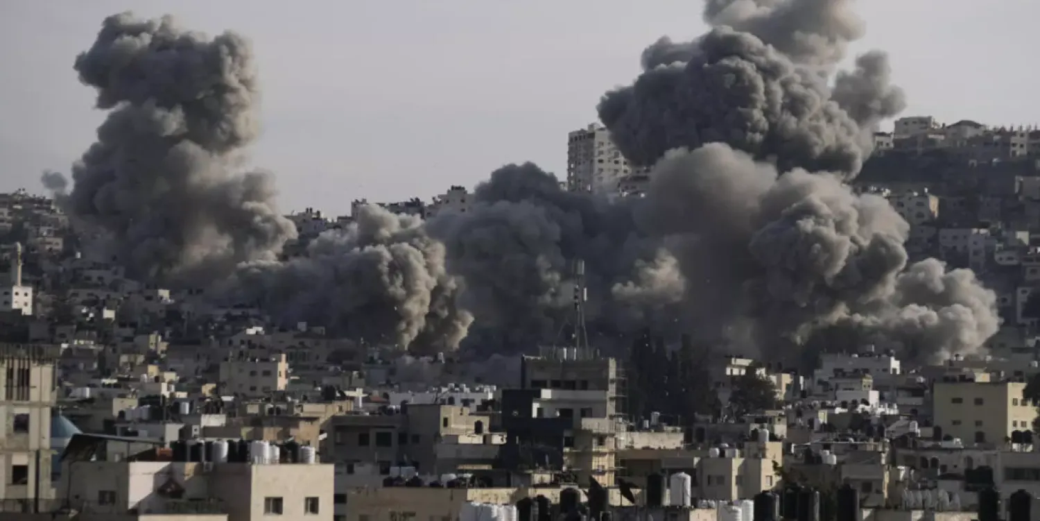 Smoke rises following an explosion detonated by the Israeli army, which said it was destroying buildings used by Palestinian militants in the West Bank Jenin refugee camp, Sunday, February 2, 2025. © Majdi Mohammed, AP
