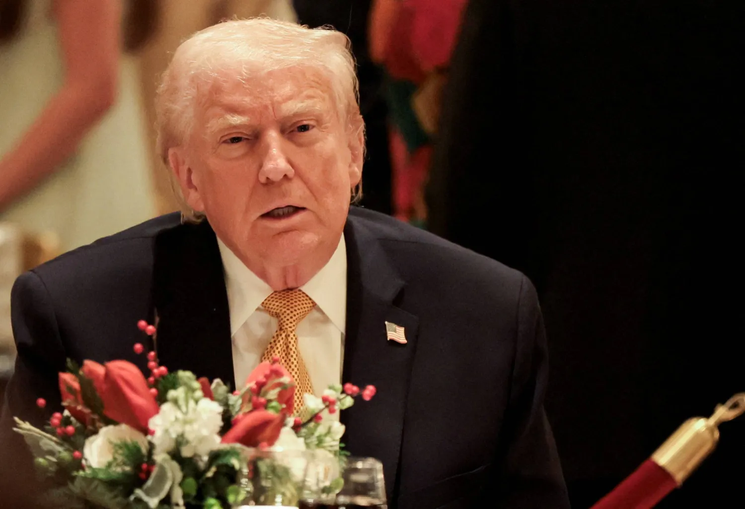 US President Donald Trump takes part in a Christmas Eve dinner in the ballroom of his Mar-a-Lago club in Palm Beach, Florida, US, December 24, 2025. REUTERS/Jessica Koscielniak