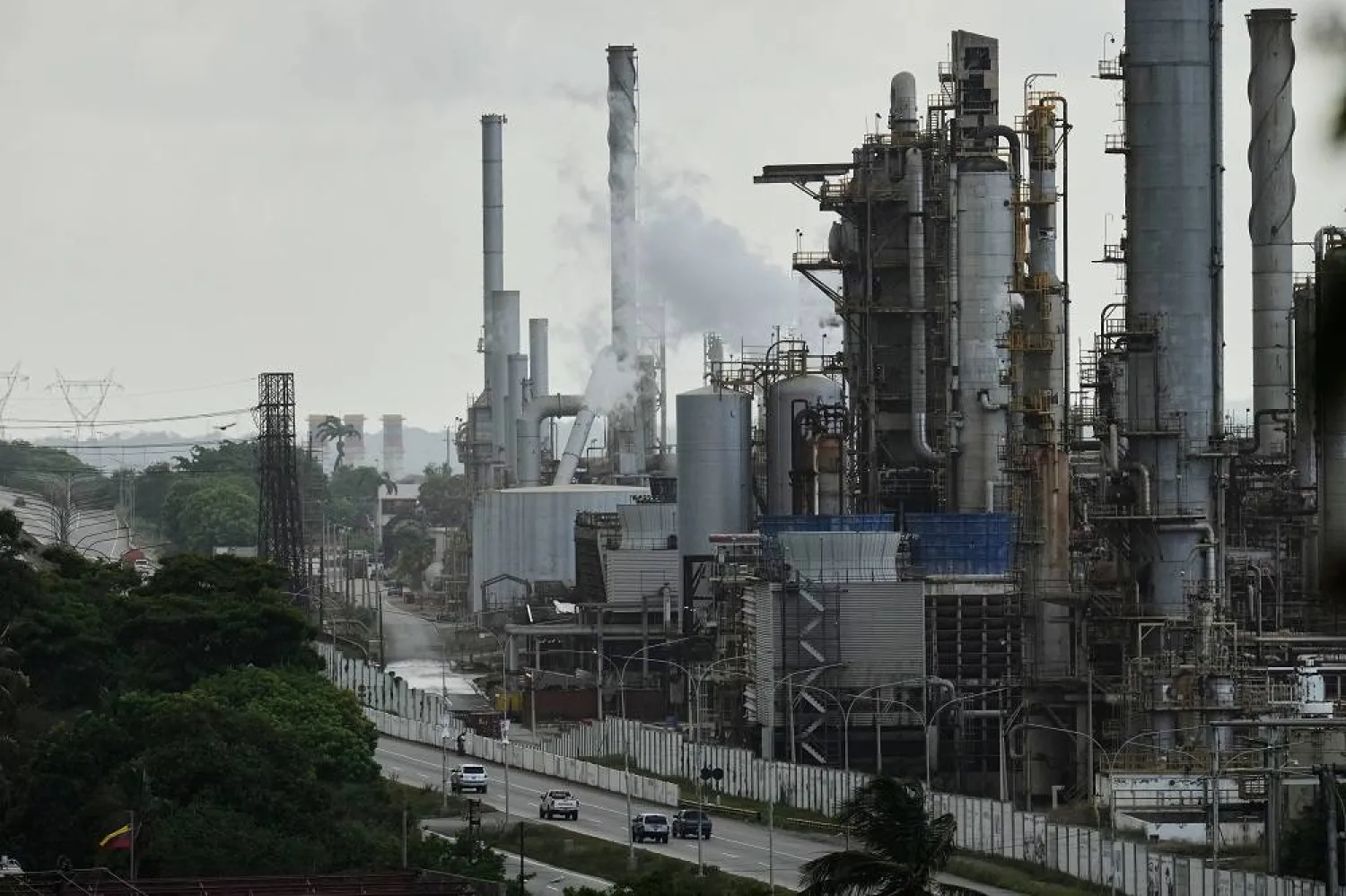 Vehicles drive past the El Palito refinery in Puerto Cabello, Venezuela, Sunday, Dec. 21, 2025. (AP)