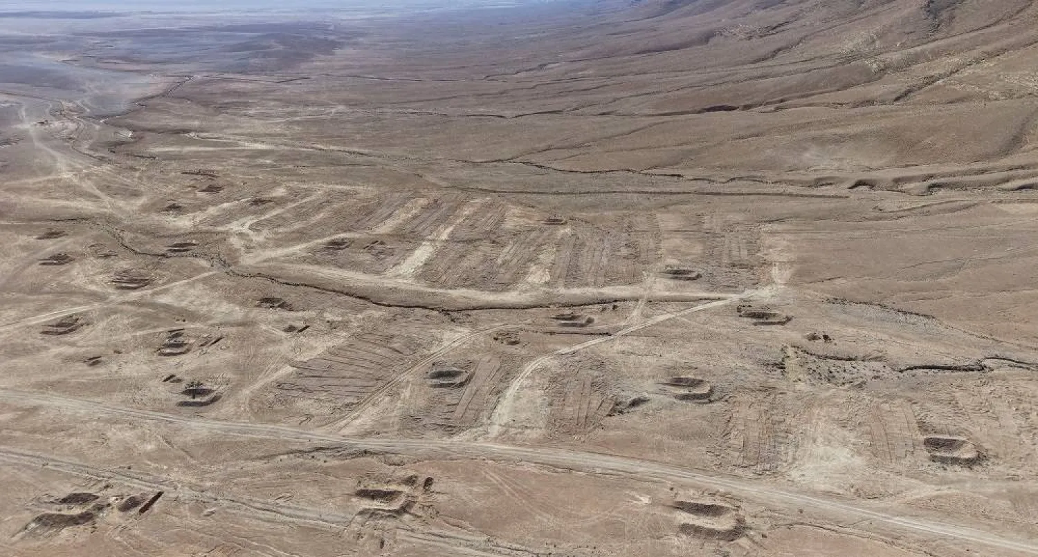 A drone view of the mass grave site in the desert near the eastern Syrian town of Dhumair, February 27, 2025. (Reuters)