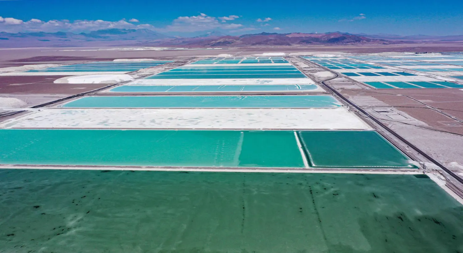 Aerial view of brine ponds and processing areas of the lithium mine of the Chilean company SQM (Sociedad Quimica Minera) in the Atacama Desert, Calama, Chile, on September 12, 2022. (AFP)