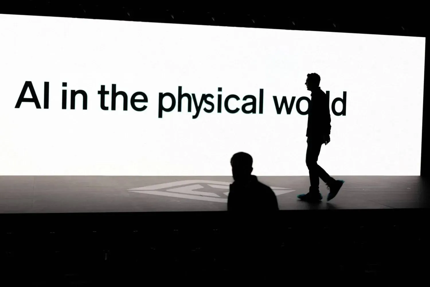 “Artificial intelligence in the physical world” is displayed on a screen during a conference showcasing advances in autonomous driving technology in California on Dec. 11, 2025. (Reuters) 