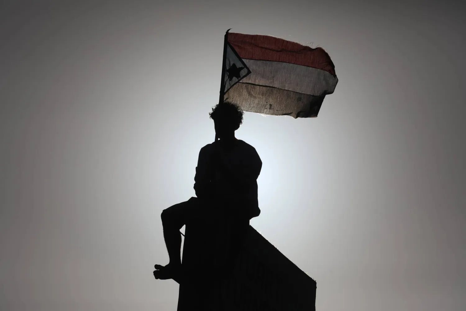 A person waves a South Yemen flag during a rally in the southern port city of Aden, Yemen, 25 December 2025. (EPA)