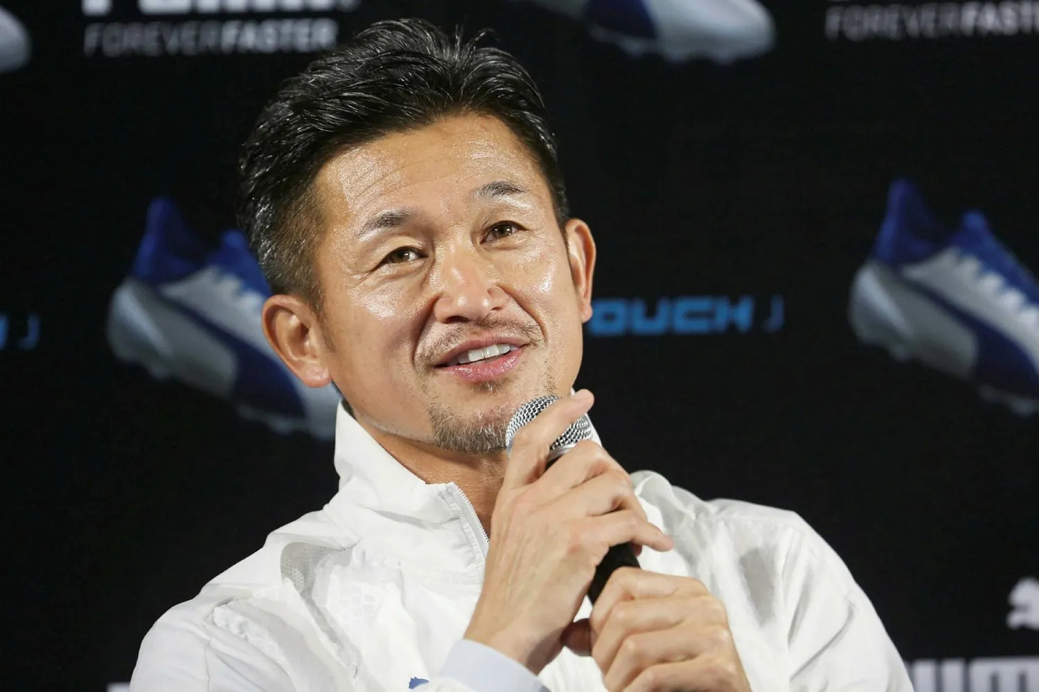 This picture taken on December 1, 2016 shows Japanese football player Kazuyoshi Miura speaking to journalists in Tokyo. (AFP)