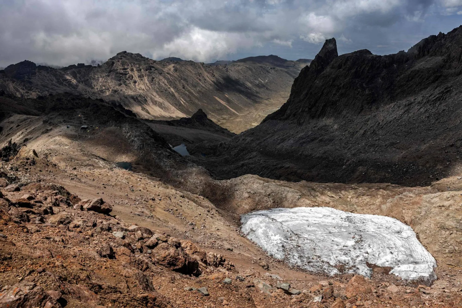 A general view of the melting Lewis Glacier in Mount Kenya National Park on March 7, 2025. (Photo by Luis TATO / AFP) 
