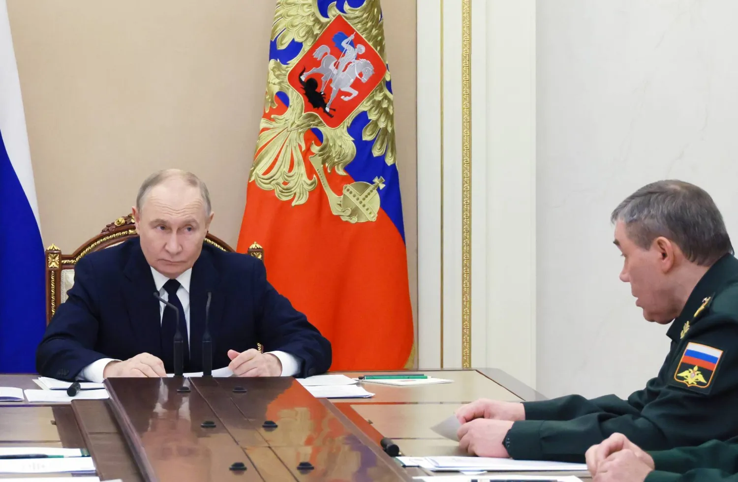 Russian President Vladimir Putin (L) chairs a meeting to discuss Russia's "special military operation" in Ukraine, as Chief of the General Staff of the Russian Armed Forces, First Deputy Defense Minister Valery Gerasimov (R) sits nearby, at the Kremlin in Moscow, Russia, 29 December 2025. (EPA/Mikhail Metzel/Sputnik/Kremlin Pool)