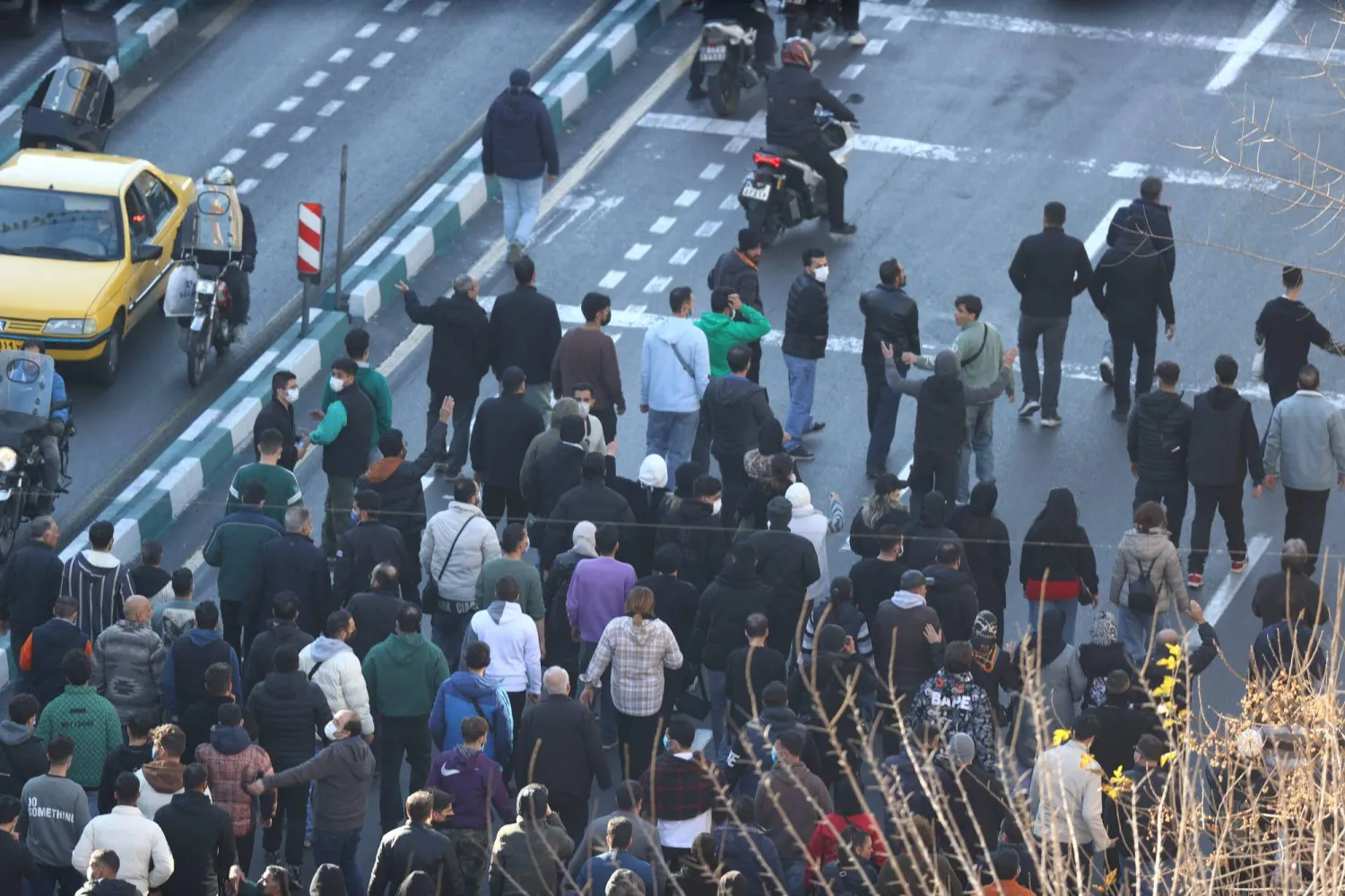 Shopkeepers and traders protest in the street against the economic conditions and Iran's embattled currency in Tehran on December 29, 2025. (Handout / Fars News Agency / AFP)
