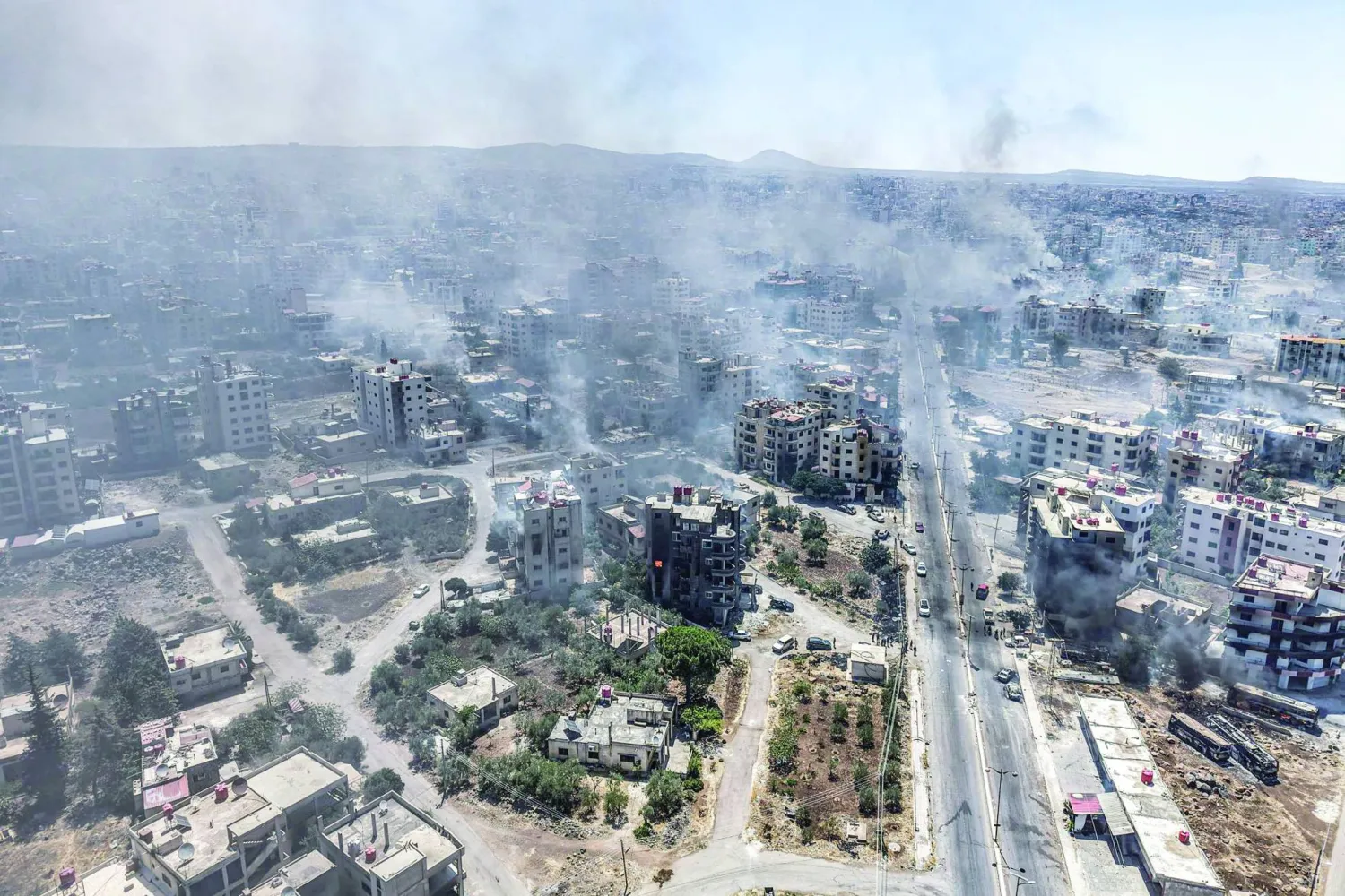 تصاعد الدخان جرّاء اشتباكات السويداء في يوليو الماضي (أرشيفية-د.ب.أ)