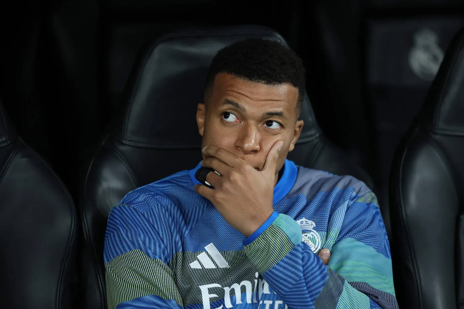 Real Madrid's French forward #10 Kylian Mbappe sits on the bench during the UEFA Champions League league phase day 6 football match between Real Madrid CF and Manchester City at Santiago Bernabeu Stadium in Madrid on December 10, 2025. (AFP)