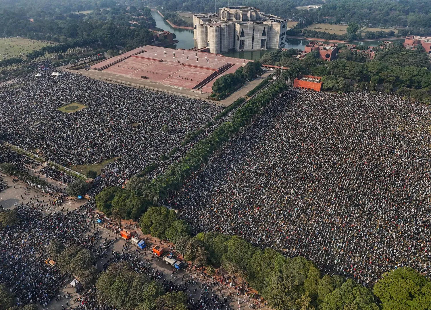 An aerial view shows mourners gathered for the funeral ceremony of Bangladesh's former Prime Minister Khaleda Zia at the Parliament House premises in Dhaka on December 31, 2025 a day after her death. (AFP)