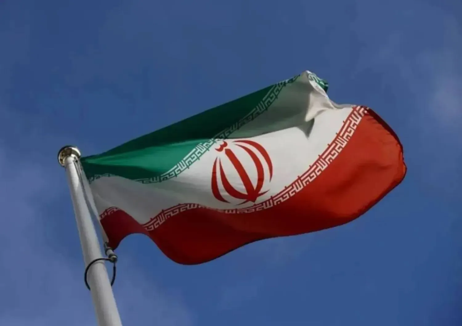The Iranian flag waves in front of the International Atomic Energy Agency (IAEA) headquarters, before the beginning of a board of governors meeting, amid the coronavirus disease (COVID-19) outbreak in Vienna, Austria, March 1, 2021. (Reuters)
