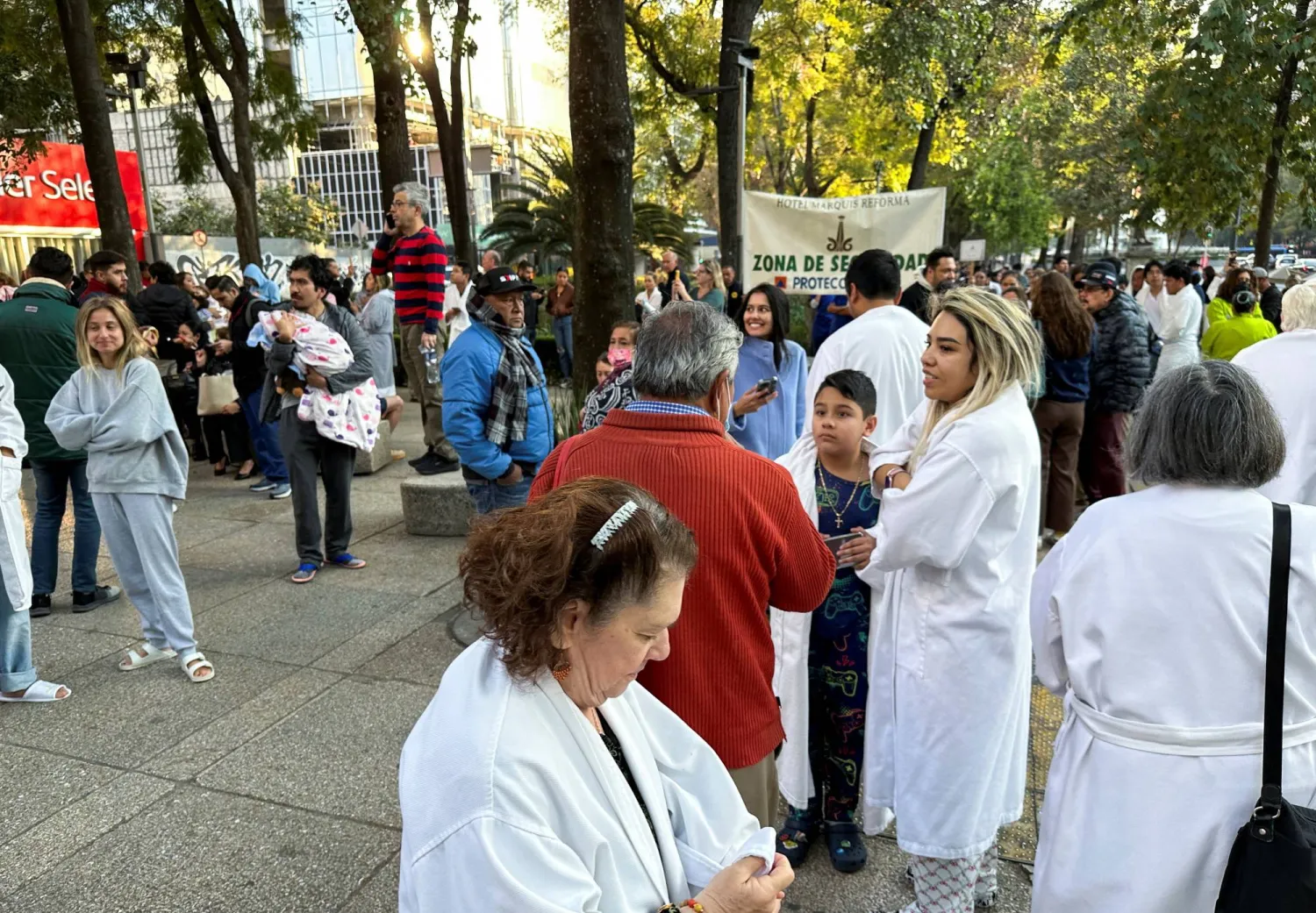 People wait outside their homes and buildings after an earthquake in Mexico City, Mexico, January 2, 2026. REUTERS/Henry Romero