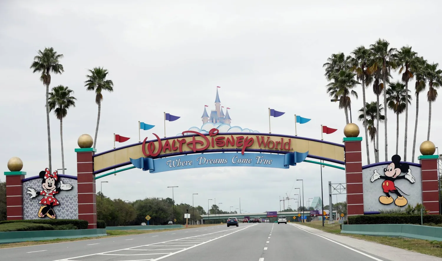 FILE - The road to the entrance of Walt Disney World, Monday, March 16, 2020, in Lake Buena Vista, Fla.  (AP Photo/John Raoux, File)