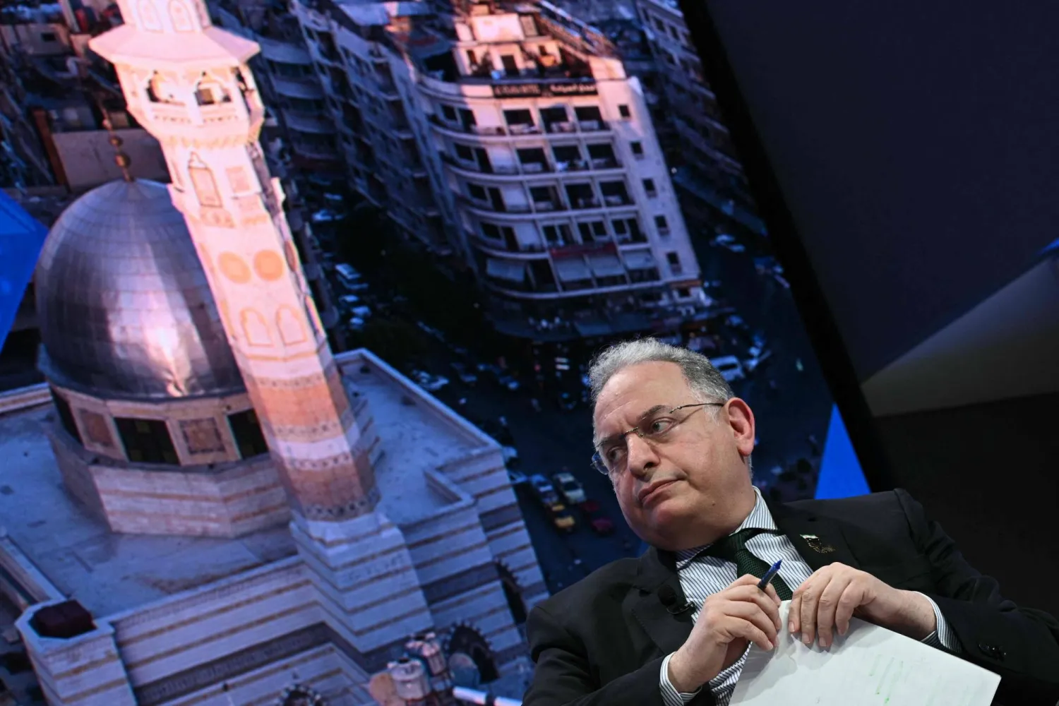 وزير المالية السوري محمد يسر برنية يتحدث خلال فعالية في الاجتماعات السنوية لصندوق النقد والبنك الدوليَّين (أ.ف.ب)