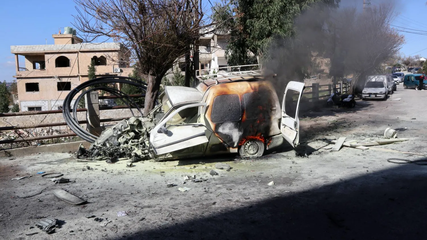 The wreckage of a car at the site after an Israeli strike on Al-Khiyam, in the Nabatieh governorate, southern Lebanon, 03 January 2026. (EPA)