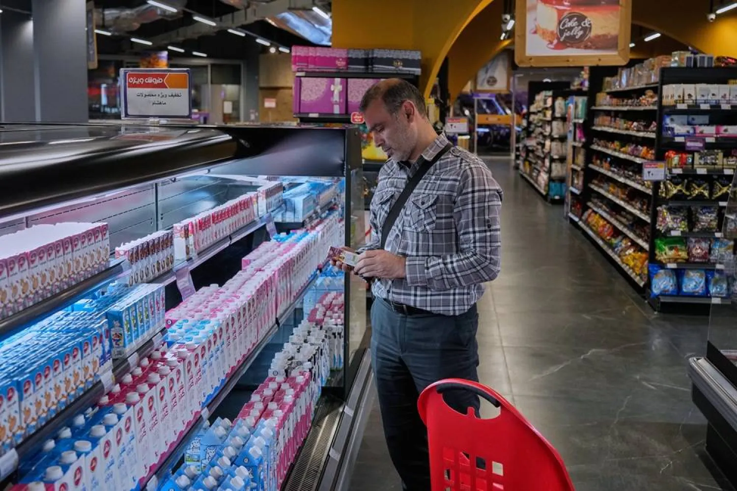 A customer shops at a supermarket at a shopping mall in northern Tehran, on Sept. 28, 2025. (AP)
