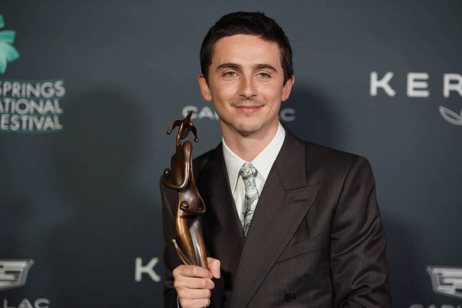 Timothee Chalamet, with the spotlight actor of the year award for "Marty Supreme," poses in the press room during the 37th Palm Springs International Film Festival Film Awards on Saturday, Jan. 3, 2026 at Palm Springs Convention Center in Palm Springs, Calif. (Photo by Jordan Strauss/Invision/AP)