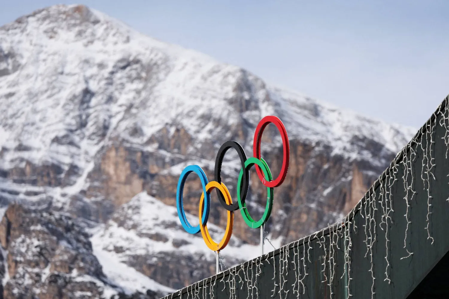 FILE PHOTO: A general view shows the Olympic rings on the Cortina Curling Olympic Stadium, which will host the curling, wheelchair curling, and Paralympic closing ceremony during the Milano Cortina Winter Olympic Games 2026, in Cortina, Italy, January 25, 2025. REUTERS/Claudia Greco/File Photo/File Photo