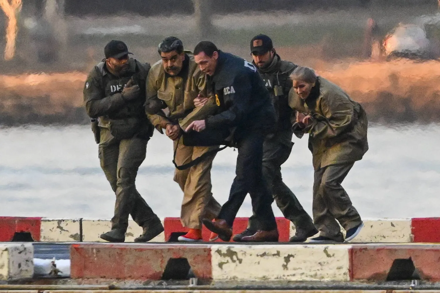 Captured Venezuelan President Nicolas Maduro and his wife, Cilia Flores, arrive at the Wall Street Heliport during their transport to the federal courthouse for their arraignment in New York, New York, USA, 05 January 2026. (EPA)