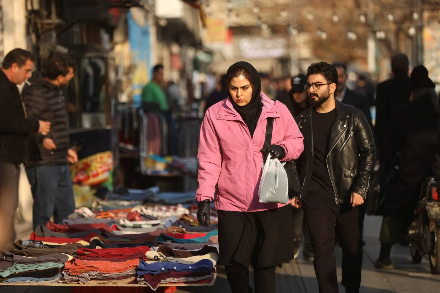 People walk on a street, as protests erupt over the collapse of the currency's value, in Tehran, Iran, January 5, 2026. Majid Asgaripour/WANA (West Asia News Agency) via Reuters