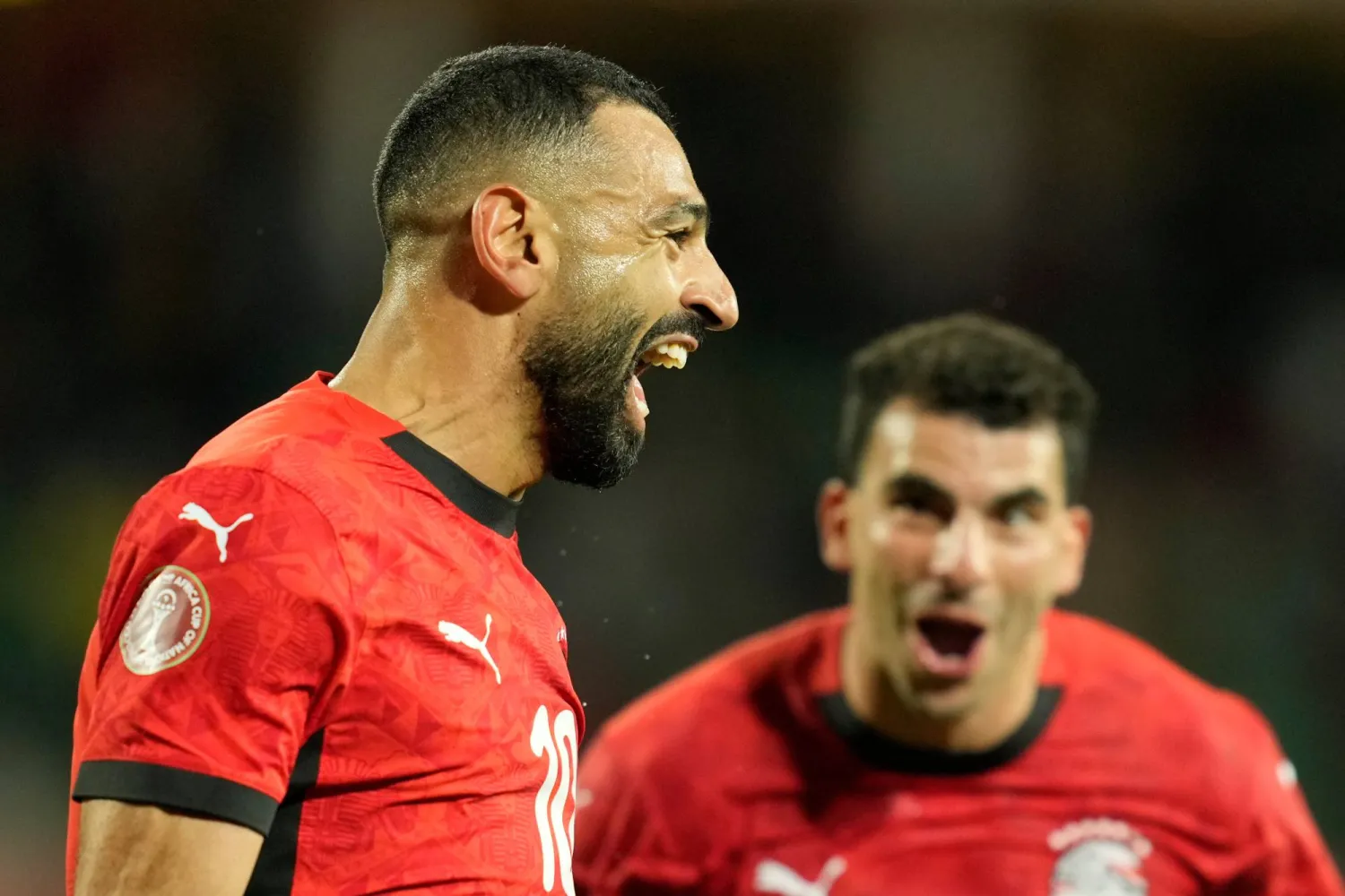 محمد صلاح يحتفل بهدفه الثالث في مرمى بنين (أ.ب)