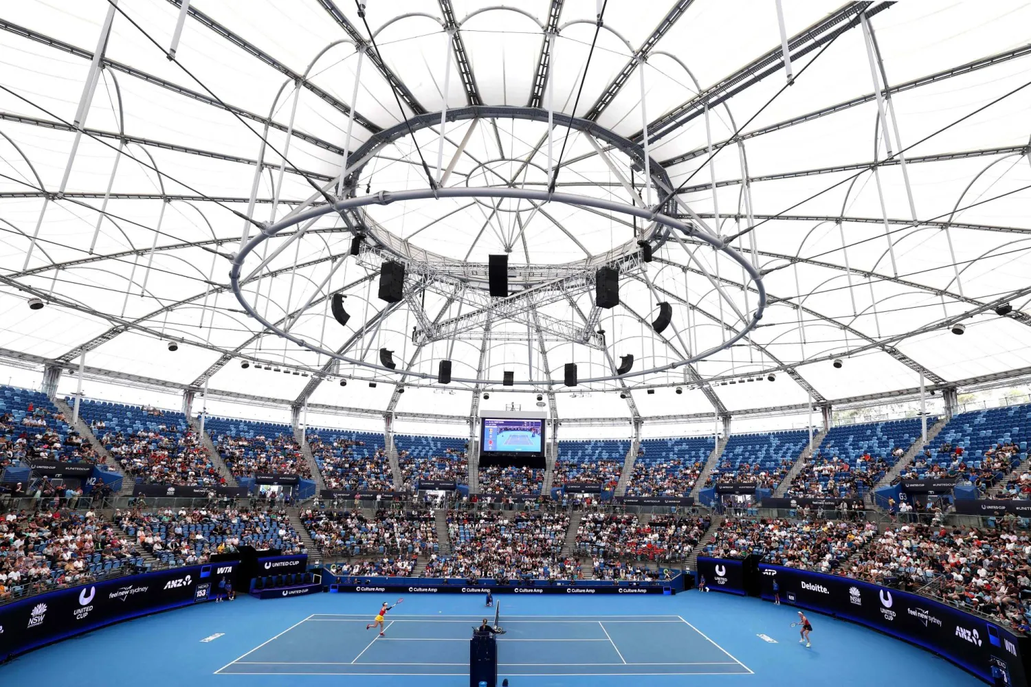 China's Zhu Lin hits a return to Belgium's Elise Mertens during their women's singles match at the United Cup tennis tournament on Ken Rosewall Arena in Sydney on January 3, 2026. (Photo by DAVID GRAY / AFP)