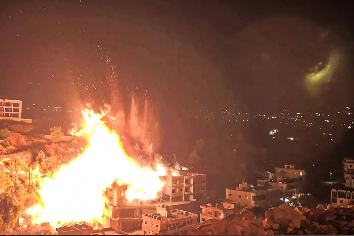 This image grab from an AFPTV footage taken on January 5, 2026, shows an Israeli strike on the  village of Kfar Hatta, in southern Lebanon. (Photo by AFPTV / AFP)