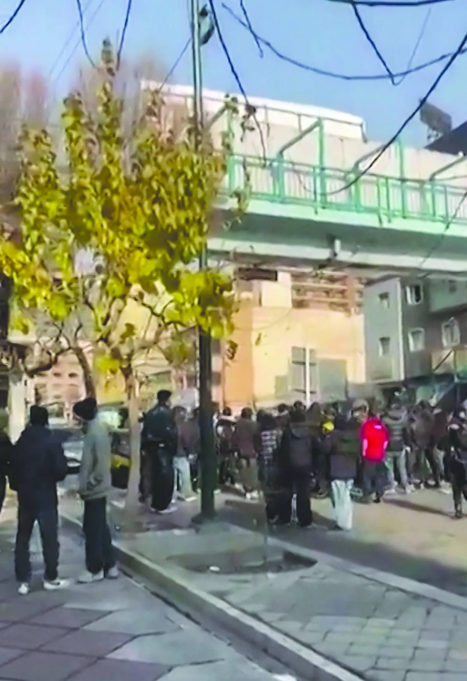 This video grab taken from UGC images and posted online on January 4, 2026, show Iranian security forces dispersing protesters with tear gas in central Tehran, as demonstrations first sparked by anger over the rising cost of living entered a second week. (Photo by UGC / AFP) 