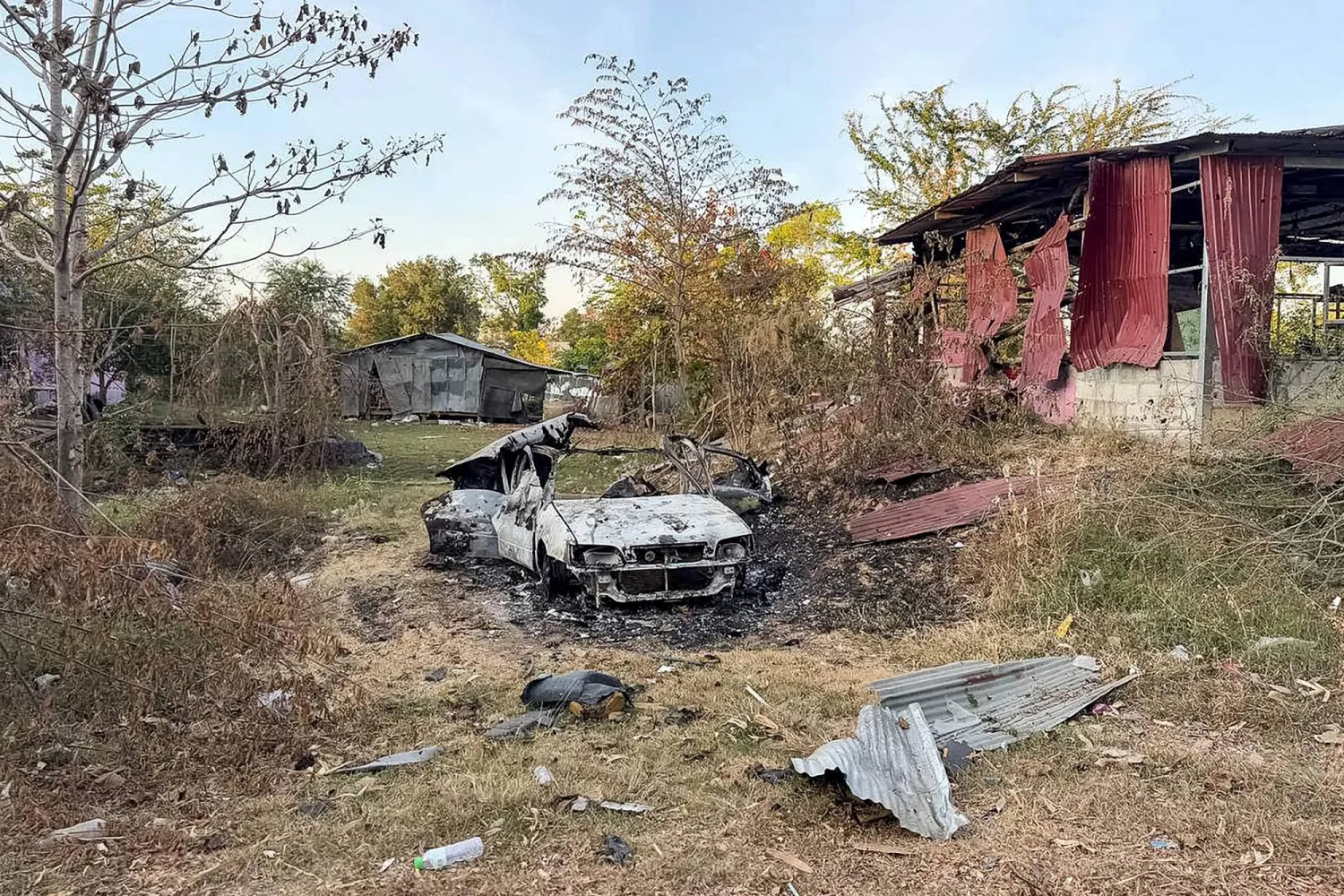 This handout photograph taken and released by Agence Kampuchea Press (AKP) on January 2, 2026 shows a general view of damaged houses following clashes between Cambodian and Thai soldiers, in Chouk Chey village in Banteay Meanchey province. (Agence Kampuchea Press (AKP) / AFP) 