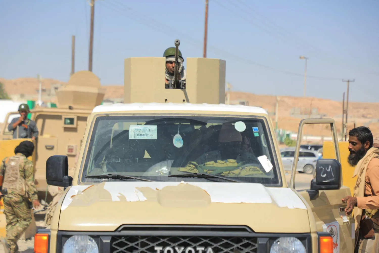 A government soldier mans a machine gun mounted on a pick-up truck in the Arabian Sea port city of Mukalla, Yemen January 4, 2026. (Reuters)