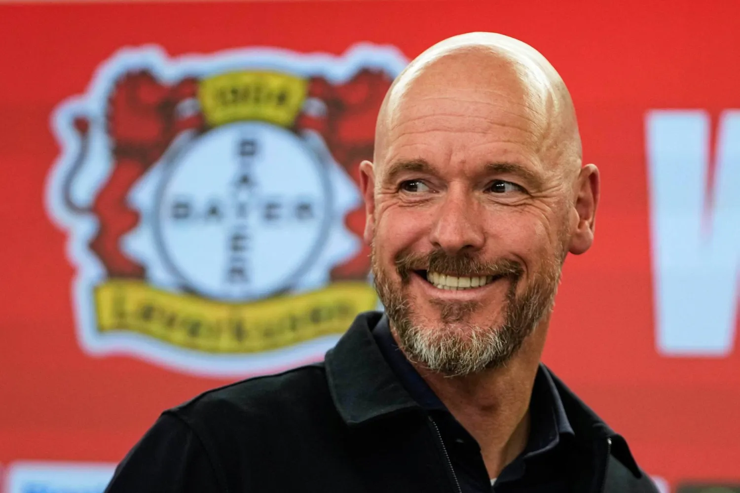 Erik ten Hag smiles during his presentation as new head coach of Bundesliga soccer club Bayer 04 Leverkusen at the BayArena stadium in Leverkusen, Germany, May 26, 2025. (AP Photo/Martin Meissner, File)