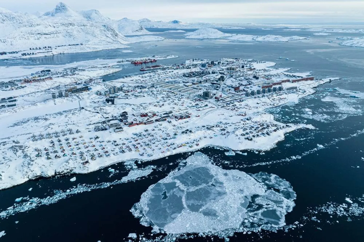 Houses covered by snow are seen on the coast of a sea inlet of Nuuk, Greenland, on March 7, 2025. (AP Photo/Evgeniy Maloletka, File) 