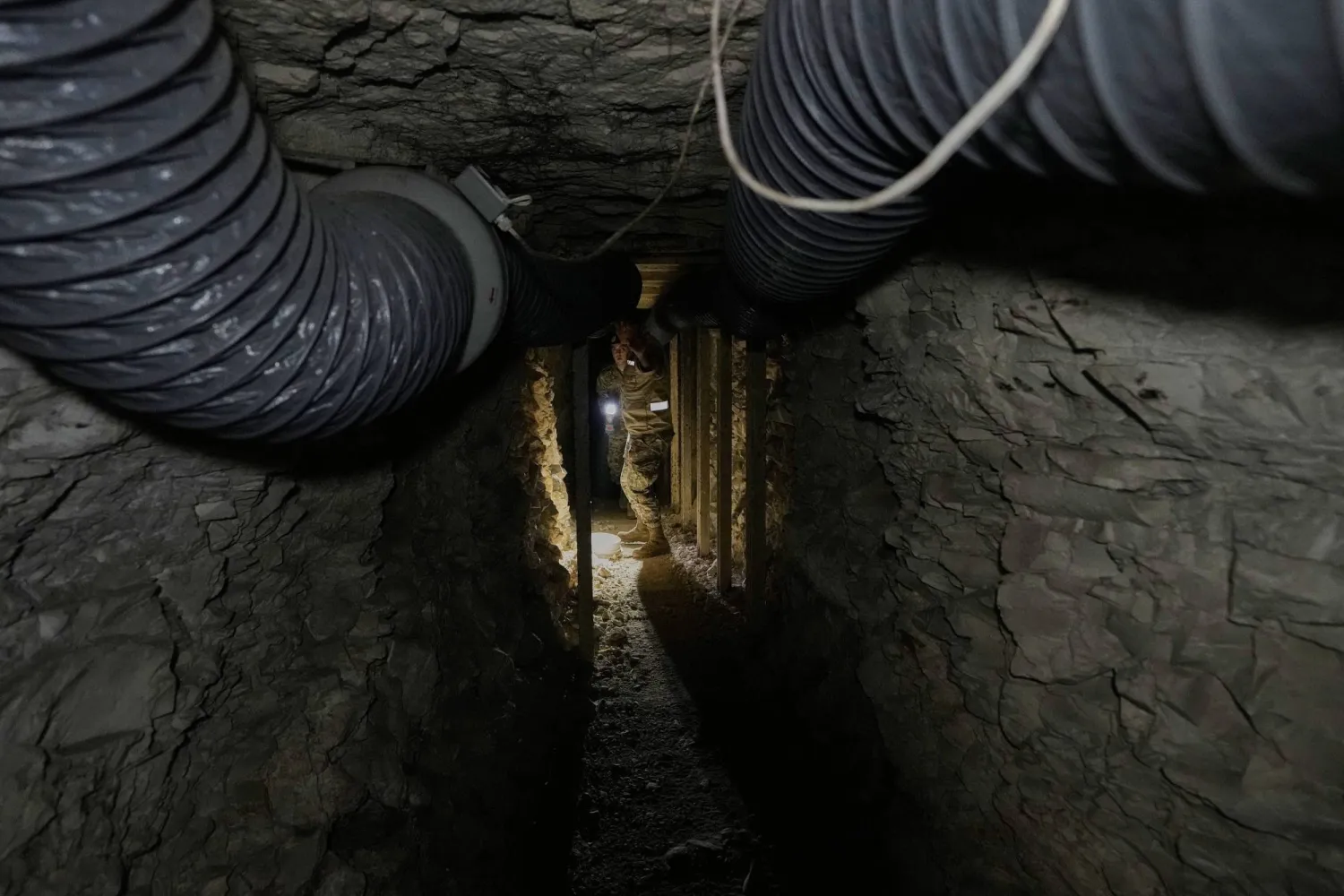 FILE - Lebanese army soldiers walk through a tunnel dug into a mountain that was used by Hezbollah fighters as a clinic and storage facility near the Lebanese-Israeli border in the Zibqin Valley, southern Lebanon, Nov. 28, 2025. (AP Photo/Bilal Hussein, File)