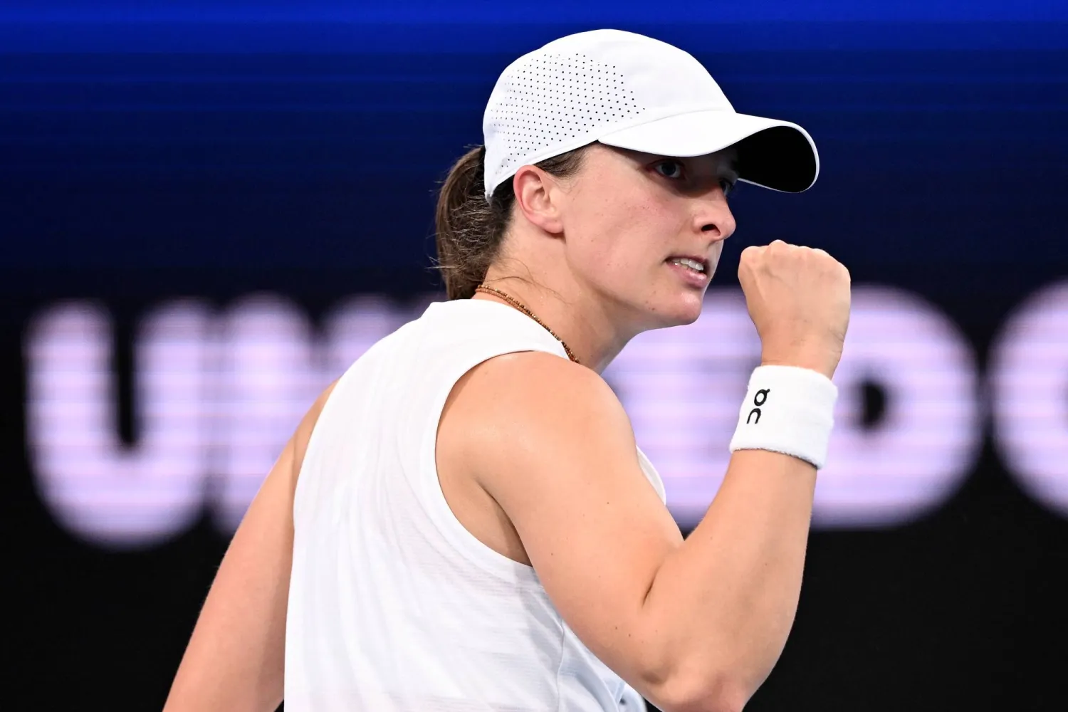 Iga Swiatek of Poland reacts while in action against Maya Joint of Australia during their quarterfinal match at the 2026 United Cup tennis tournament at Ken Rosewall Arena in Sydney, Australia, 09 January 2026. (EPA)