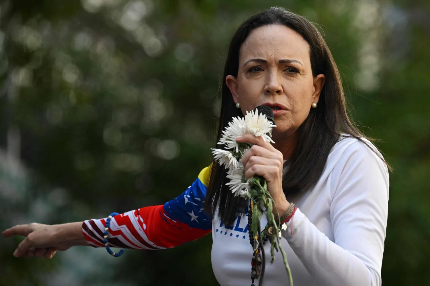 Venezuelan opposition leader Maria Corina Machado addresses supporters during a protest called by the opposition on the eve of the presidential inauguration in Caracas on January 9, 2025. (AFP)