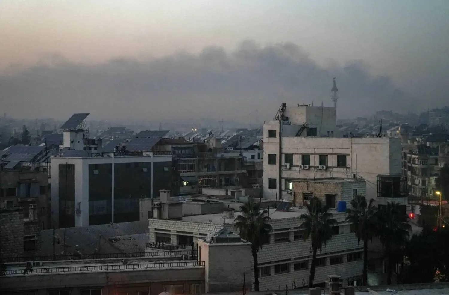 Thick smoke rises from areas of fighting between the Syrian army and the SDF in Aleppo (EPA) 