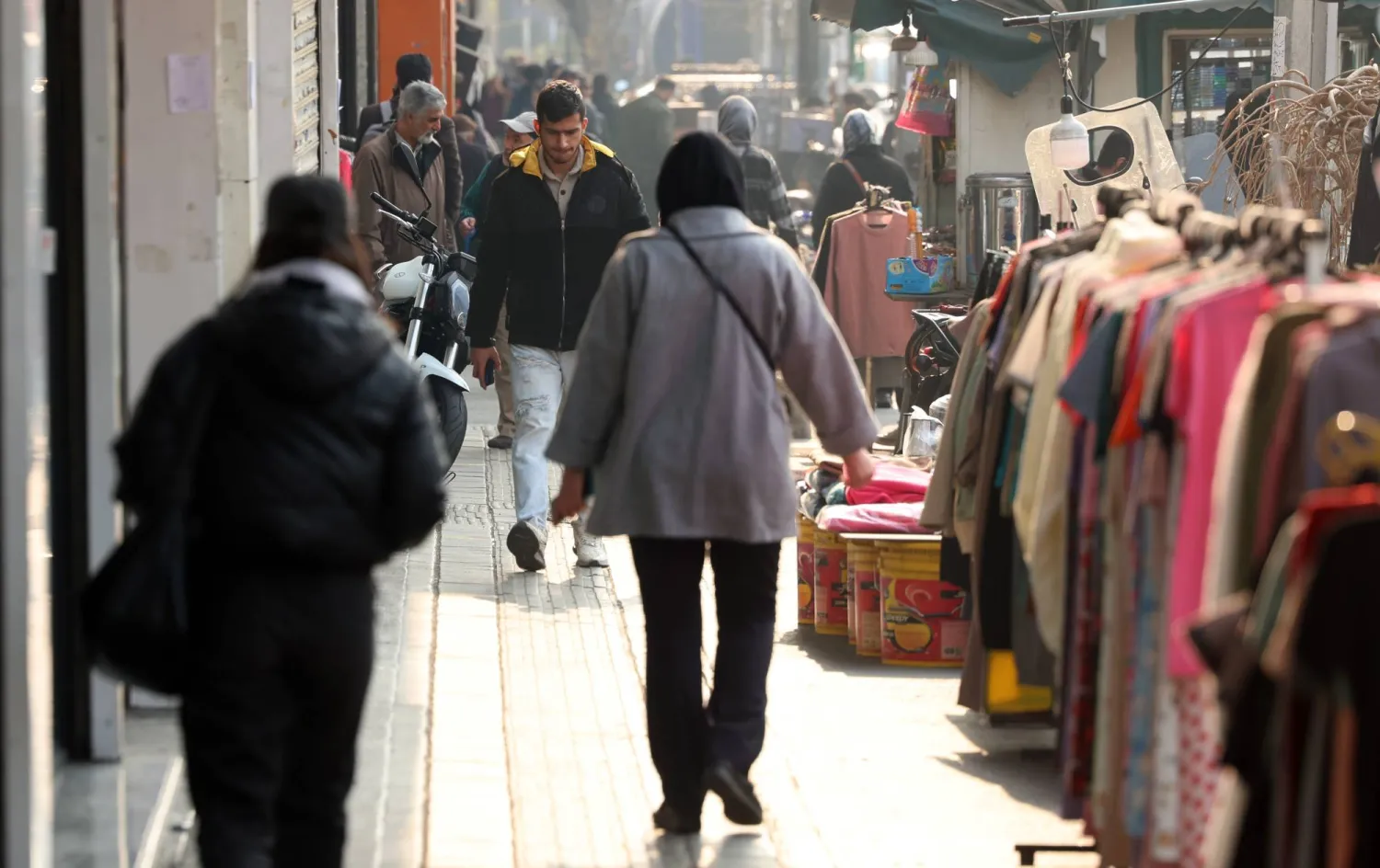 Iranians walk on a street in Tehran, Iran, 08 January 2026. (EPA)