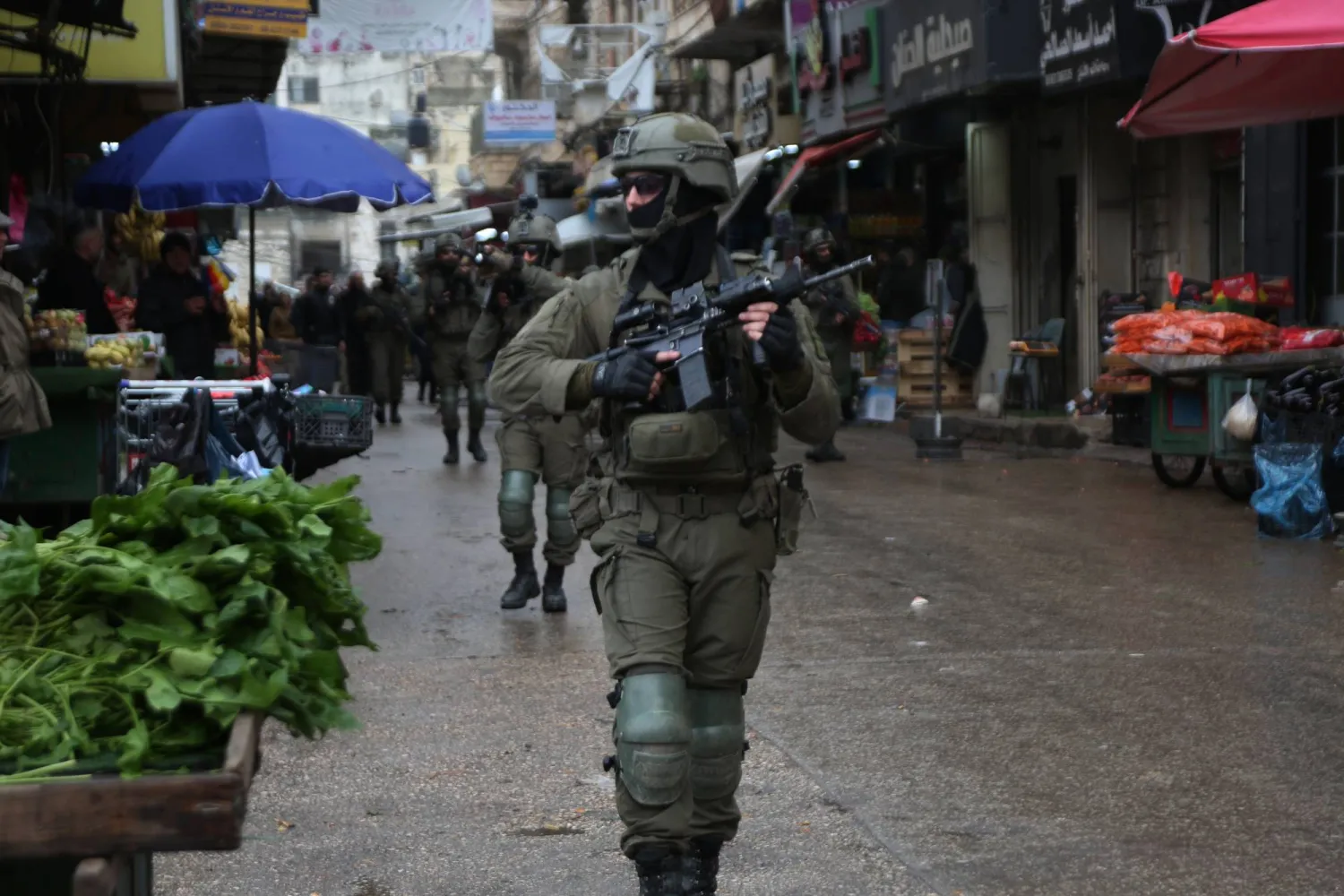  01 January 2026, Palestinian Territories, Nablus: Israeli forces raid shops in the central market and opened fire toward a residential building, detaining several Palestinians in the Old City of Nablus in the West Bank. (dpa)