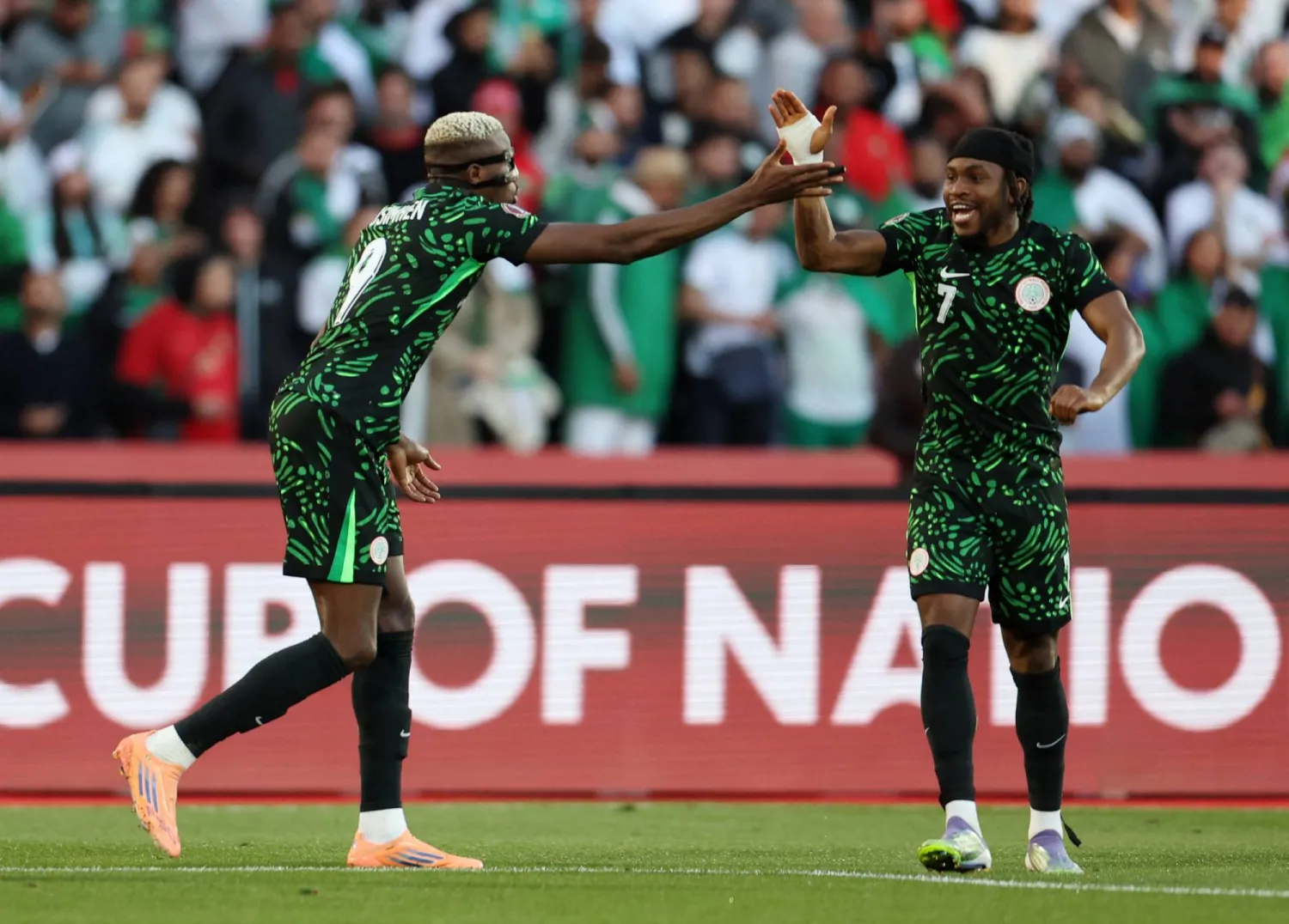  Soccer Football - CAF Africa Cup of Nations - Morocco 2025 - Quarter Final - Algeria v Nigeria - Grand Stadium of Marrakech, Marrakech, Morocco - January 10, 2026 Nigeria's Victor Osimhen celebrates scoring their first goal with Ademola Lookman. (Reuters)