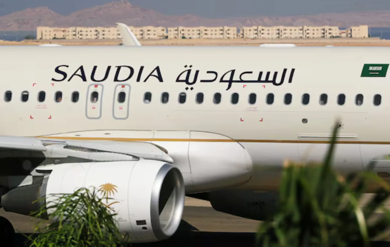 Saudi Arabian Airlines plane, is seen at the airport of the Red Sea resort of Sharm el-Sheikh, Egypt, August 9, 2021. Picture taken through a window. REUTERS/Mohamed Abd El Ghany/File Photo