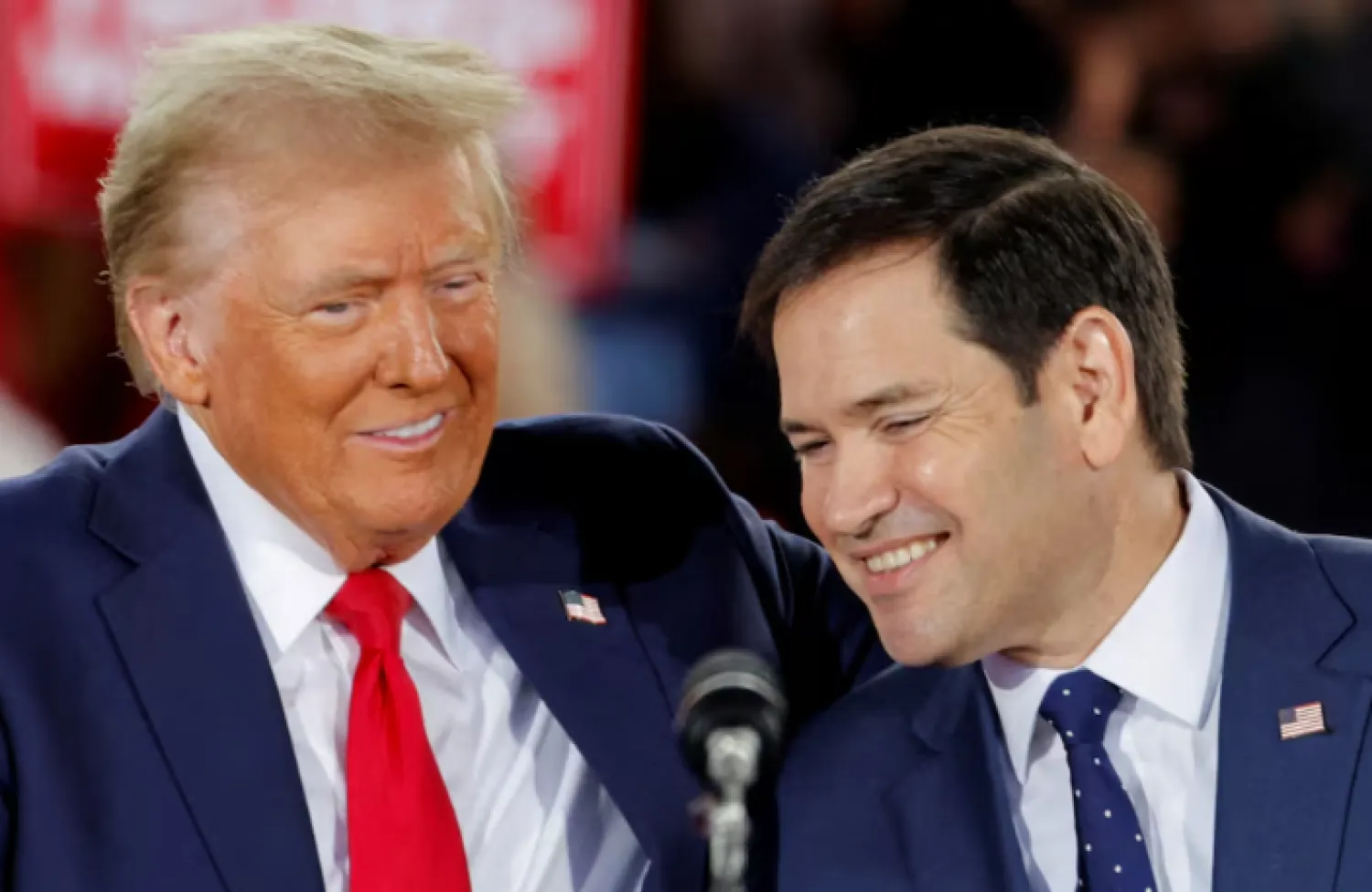 Republican presidential nominee and former US President Donald Trump and Senator Marco Rubio (R-FL) react during campaign event at Dorton Arena, in Raleigh, North Carolina, US November 4, 2024. REUTERS/Jonathan Drake/