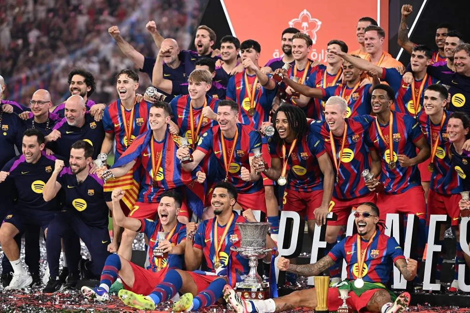 Players of Barcelona celebrate with the trophy after winning the Spanish Super Cup final soccer match between Barcelona and Real Madrid in Jeddah, Saudi Arabia, 11 January 2026. (EPA)