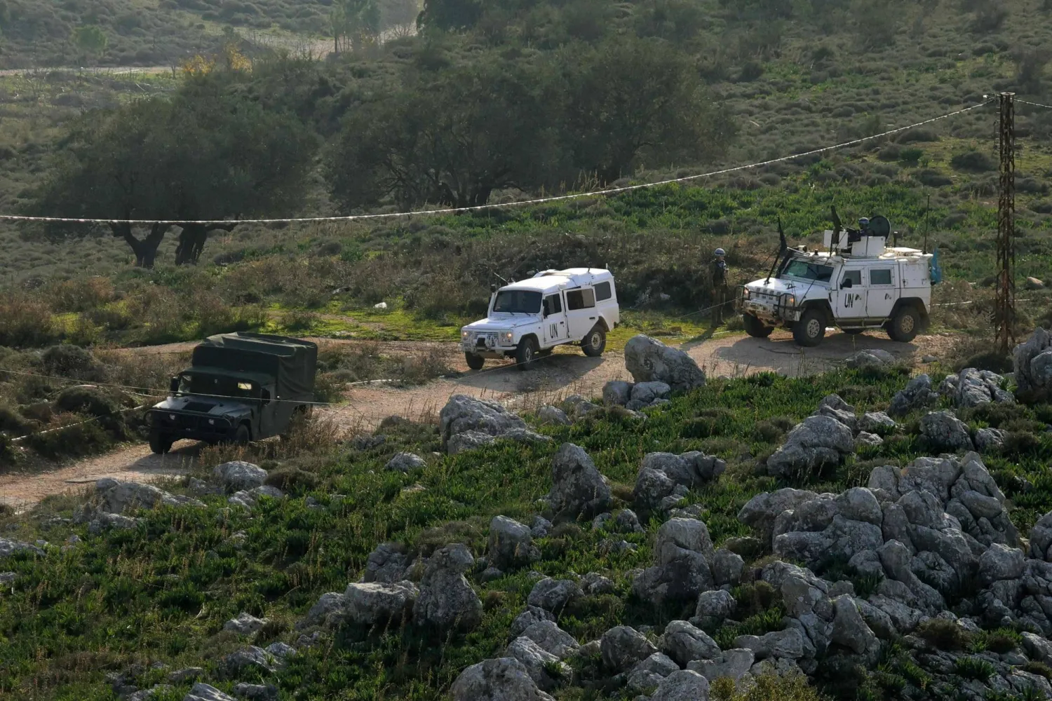 United Nations peacekeepers with the UN Interim Force in Lebanon (UNIFIL) patrol in vehicles together with Lebanese soldiers in the Buwayda region of Marjayoun, near the border with Israel in southern Lebanon, on January 8, 2026. (Photo by Rabih DAHER / AFP)