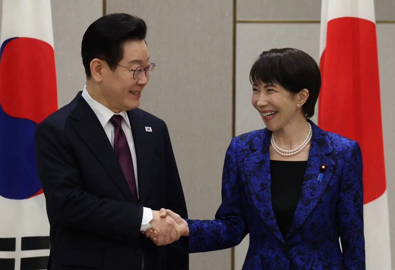 13 January 2026, Japan, Nara: Japan's Prime Minister Sanae Takaichi shakes hands with South Korea's President Lee Jae Myung at the start of their summit meeting in Nara. (dpa)