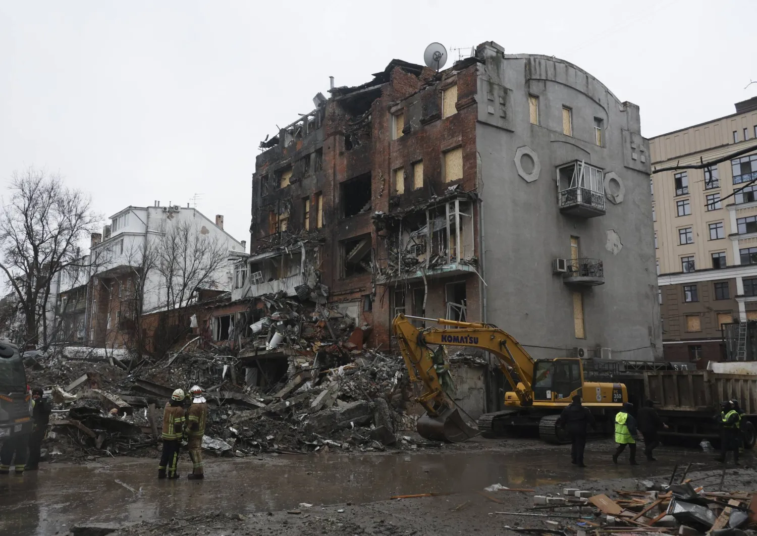 Ukrainian rescuers work at the site of a Russian strike on a residential area a day before, in Kharkiv, northeastern Ukraine, 03 January 2026, amid the Russian invasion. EPA/SERGEY KOZLOV