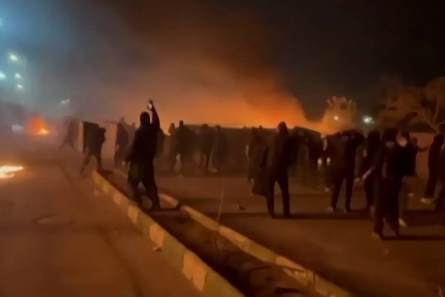 This video grab taken on January 13, 2026 from UGC images posted on social media on January 10, 2026 shows clashes in Mashhad, in northeastern Iran. (UGC/AFP)