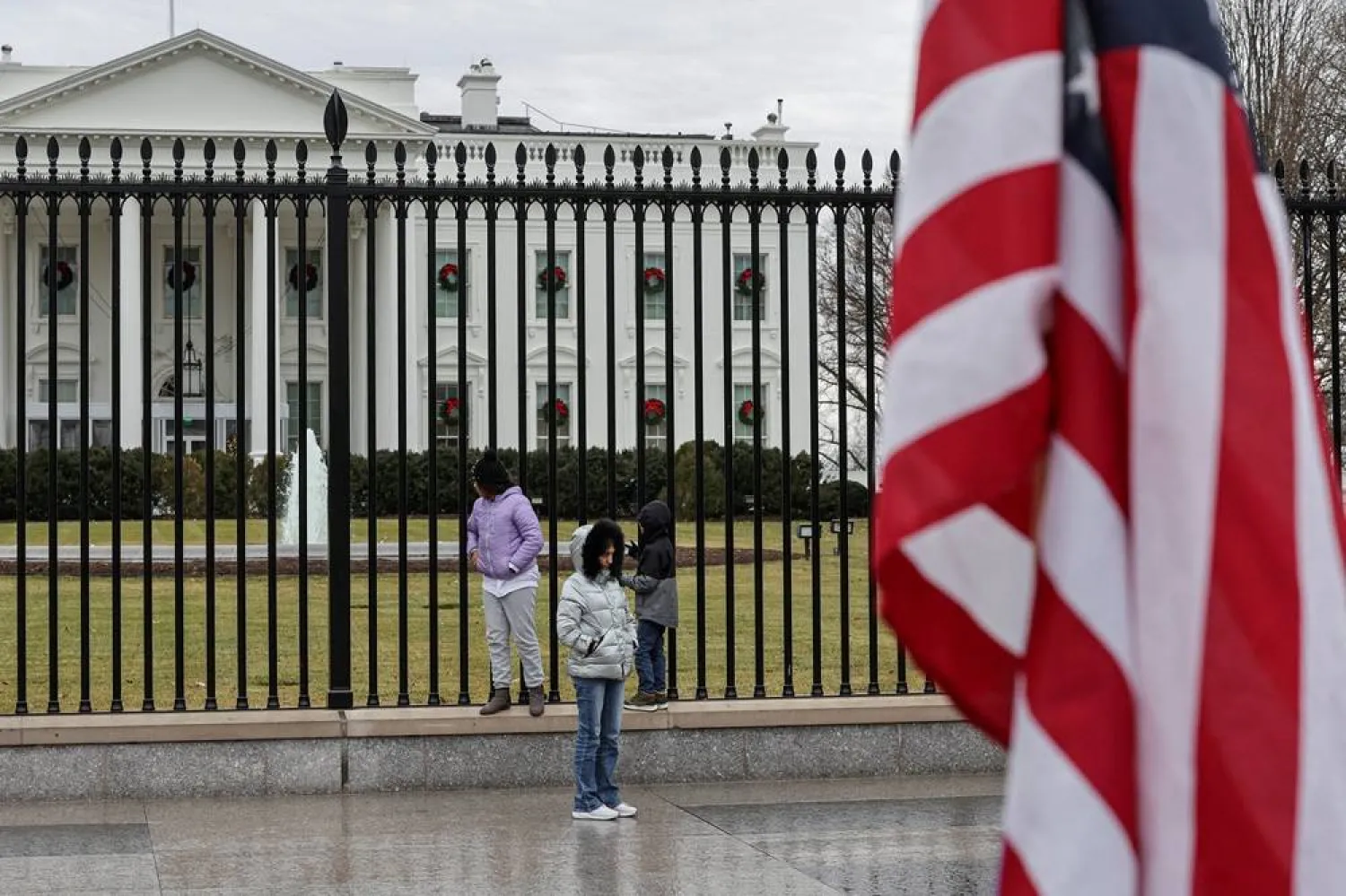 Tourists stand next to the fence of the White House in Washington, DC, US December 26, 2025. (Reuters)